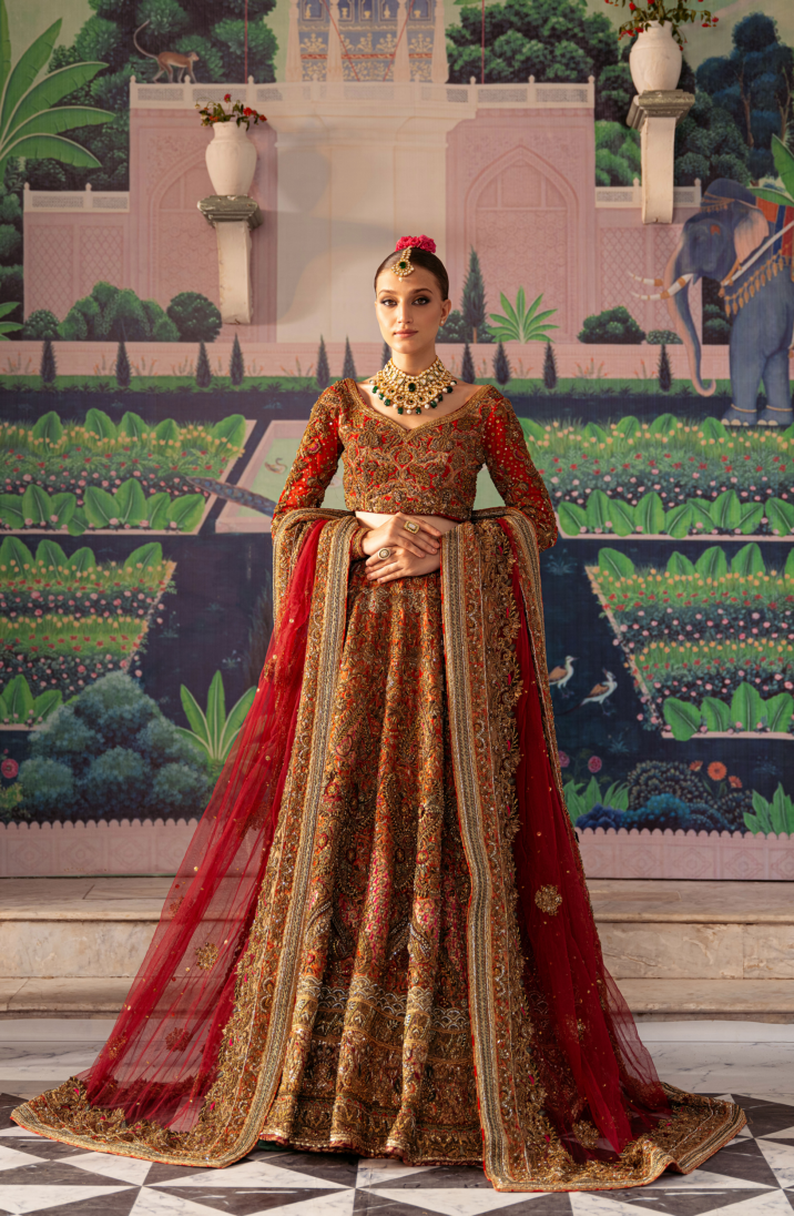 Meticulously Crafted Tangerine Red Bridal Lehenga Choli Ensemble